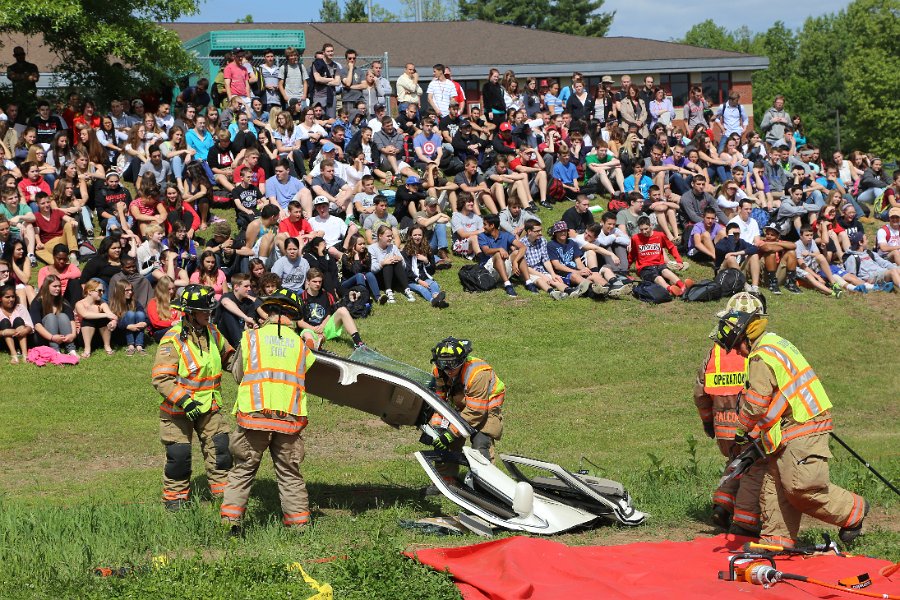 IMG_2040.JPG - Students look on as firefighters work tediously 