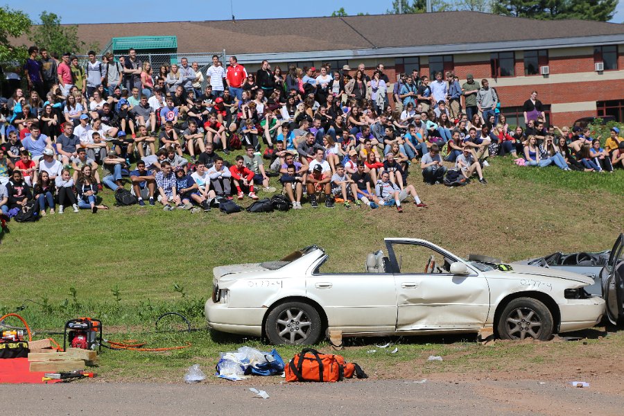 IMG_2066.JPG - Students look at the car that has been turned to no more than the basic frame